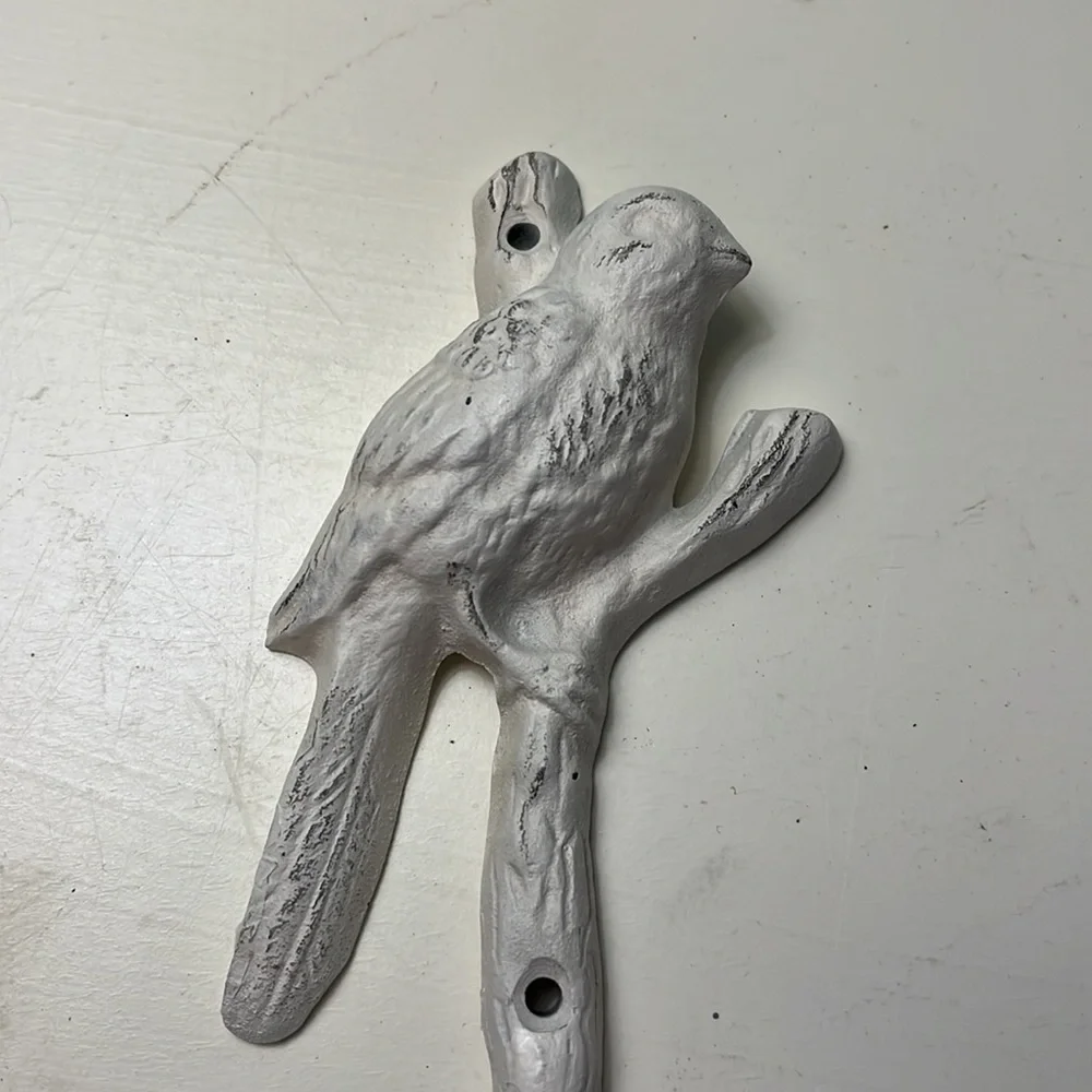 Bird and branch coat hook.